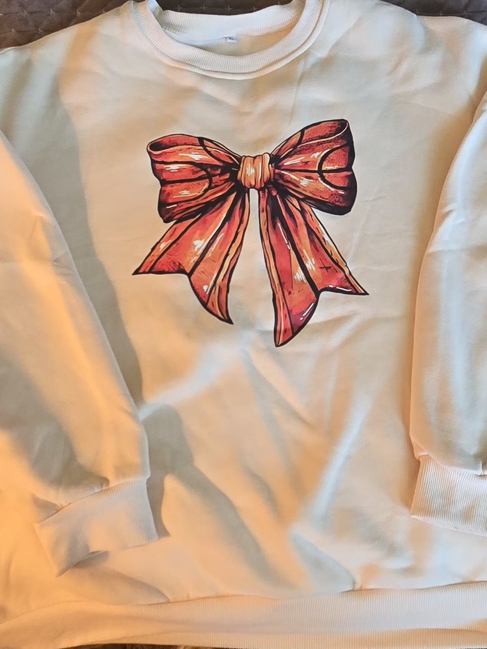 Kids Cream Sweatshirt with Red Bow Graphic